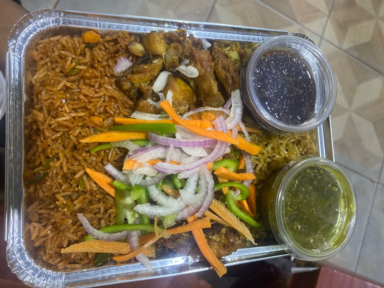 Fried rice with chicken, fresh vegetables and pepper sauces
