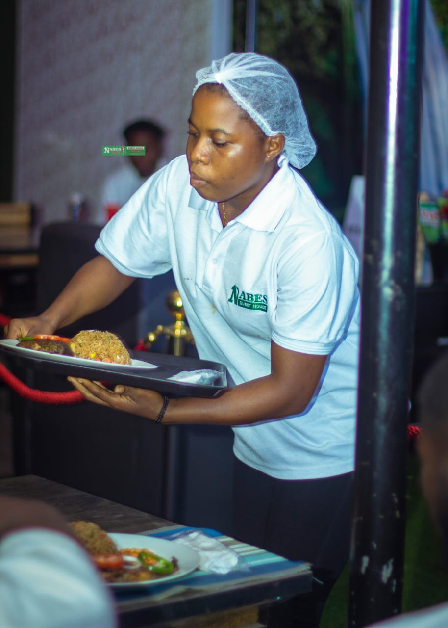 Staff serving fried rice and grilled chicken at the Kotoku restaurant