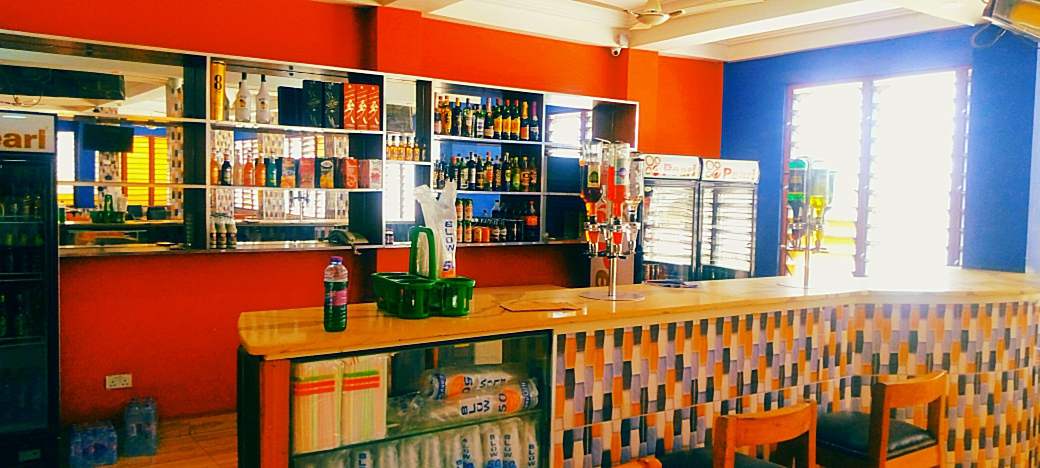 Well-stocked pub bar with bright walls at the Kotoku branch